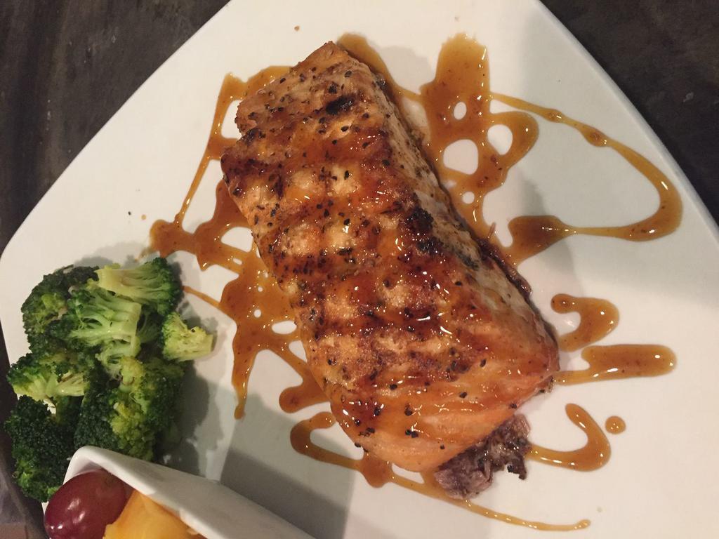 Salmon Filet · 8 oz. of fresh-never-frozen North Atlantic salmon, seasoned and flame-grilled topped with a bourbon glaze or have it blackened. Served with a salad and 1 side.