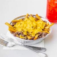 Cheesesteak Fries · French fries topped with thinly sliced steak and wiz. Add ons for an additional charge.