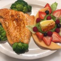Broiled Salmon · With lemon butter sauce. Served with salad, choice of potato, bread, and butter. Served with...