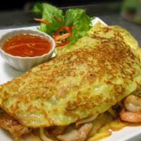 Vietnamese Crepe · Banh xeo. Thin and crunchy Vietnamese savory sizzling rice flour coconut cake filled with sh...