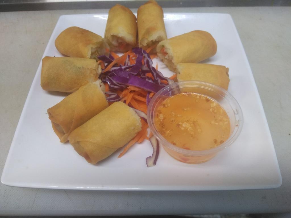A1. Fried Egg Rolls · 4 pieces. Shredded cabbage and carrot with glass noodles wrapped in pastry paper and deep-fried. Served with sweet chili sauce.