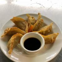 A5. Golden Potstickers · 7 pieces. Deep-fried dumplings filled with cabbage and chicken or pork. Served with sweet ch...
