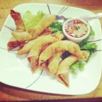 AA. Sleeping Prawns · 8 pieces. Deep-fried tiger prawns wrapped in wonton skin and served with sweet chili sauce.