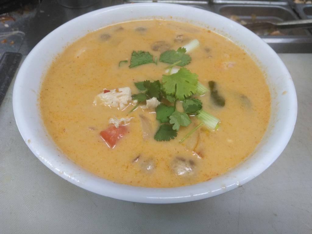 A12. Tom Kha Soup · Coconut milk based soup with cilantro, galangal, kaffir lime leaves, mushrooms, onion, tomato.