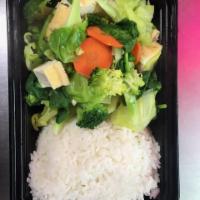 31. Swimming Angel · Not a stir-fry, but a medley of steamed broccoli, cabbage, spinach, your choice of protein a...