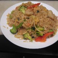 68. Kao Pad Gaprao · Fried rice cooked in a house chili and garlic sauce with Thai basil leaves, bell pepper, mus...