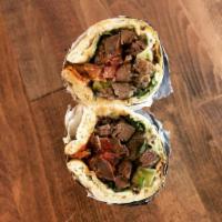 Gyro · Shaved lamb, pita stuffed with lettuce, tomatoes, tzatziki, red onions and house made Greek ...