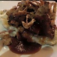 Slow Cooked Beef Short Ribs · Tender slow cooked short ribs served over mashed red skin potatoes. Topped with fried shallo...