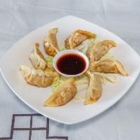 Asian Potstickers · 8 pieces. Pork and vegetable dumplings served with a ginger soy dipping sauce for a healthie...