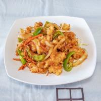 Calamari Salad · Lightly battered calamari tossed over a bed of cabbage, bell peppers, onions and carrots in ...