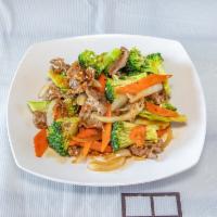Beef Broccoli · Sliced beef with fresh broccoli, carrots and onions in a brown garlic sauce.