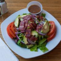 GK Appetizer Salad · Chopped lettuce, avocado, goat cheese, turkey bacon, tomato & onion. Served with mustard vin...