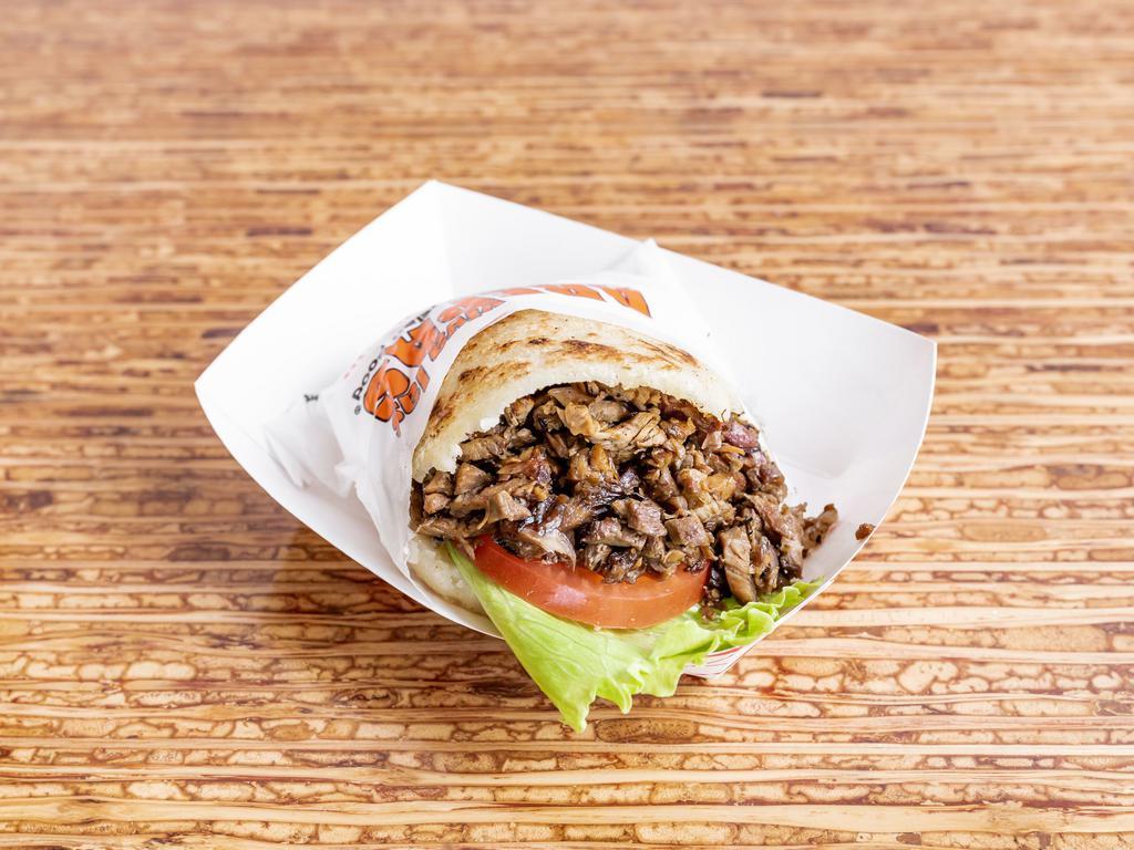 1. Wood Fire Beef Arepas · Served with tomato, lettuce, and onions.

