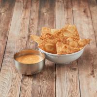 Chile con Queso · Ranchera sauce and cheese melted together, served with flour tortilla chips. Add meat for an...