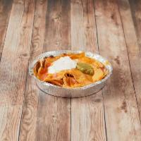 Cheese Nachos · Corn chips topped with ranchera sauce melted Monterey Jack and cheddar cheese, guacamole, to...