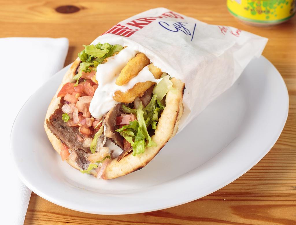 GYRO  · beef and lamb shaved with Lettuce, tomato, onions, tzatziki sauce on grilled pita.