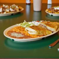 Quesadilla Combo · Served with rice, beans, salad, and tortillas