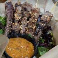 Grilled Beef Satay Skewers · Marinated beef skewers with or without spicy peanut dipping sauce.