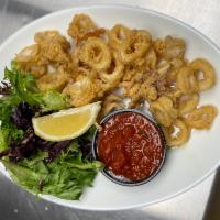 Calamari · Rings and tentacles dreged in our house flour blend flash fired and served with our robust h...