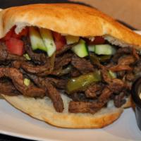 Lamb Shawarma · Thinly sliced roasted meat sandwich. 