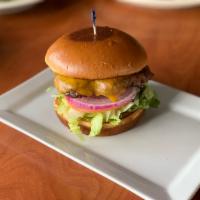 Stacks Cheeseburger · Char broiled beef patty with lettuce, tomato and red onion on a grilled brioche bun.