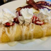 Strawberry Cream Crepes · Sweet cream and fresh strawberry slices stuffed into sweet crepes. Then drizzled with sweet ...