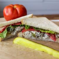 Chicken Salad Sandwich · Bennett’s house made chicken salad with grapes and nuts is generously scooped on locally bak...