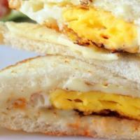 Dad's Fried Egg Sandwich · Two fried eggs on locally baked white toast with salt and pepper.