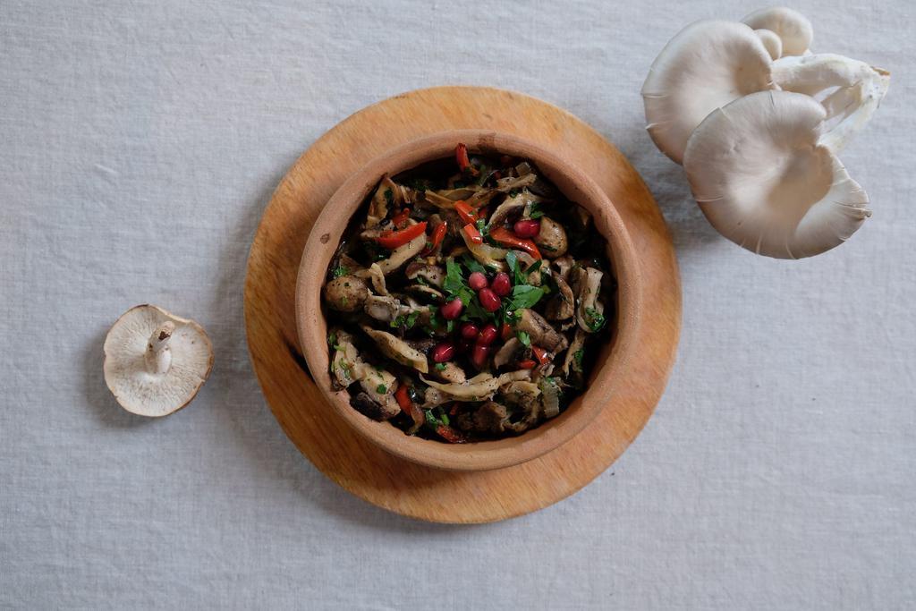 Roasted Wild Mushrooms Plate · A blend of cremini, oyster, shitake and white button mushrooms with roasted sweet red pepper and cilantro. Vegetarian.