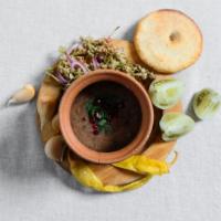 Lobio in a Clay Pot with Fermented Vegetables Plate · Been stew, onion, garlic, Georgian spices. Served with cornbread and fermented vegetables. V...