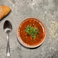 Soup Kharcho (Beef Soup) · Our winter soup made with spiced beef broth, tomato and rice, enriched with herbs and Georgi...
