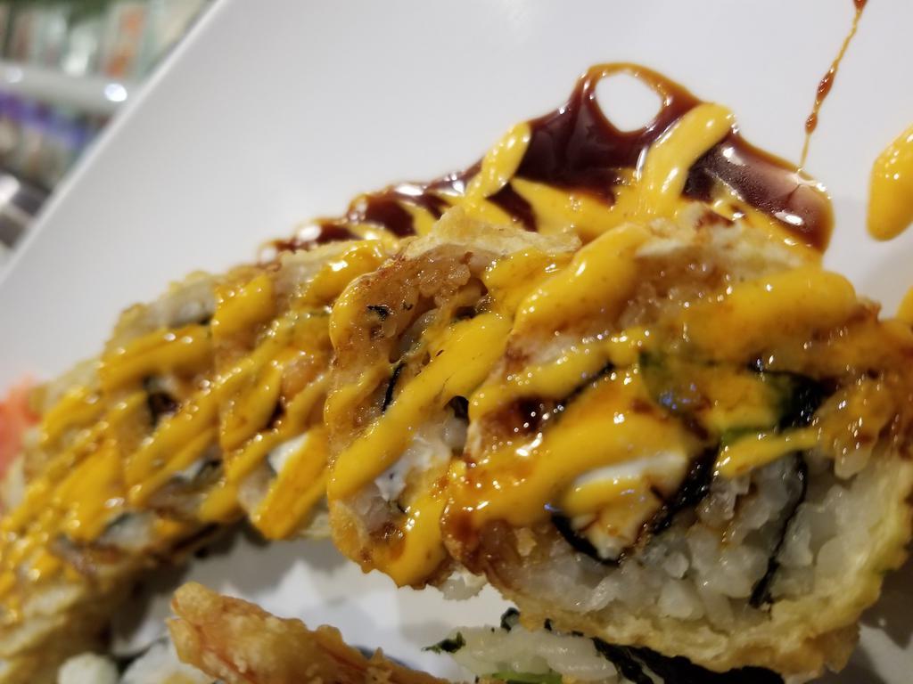 New York Roll · Salmon and cream cheese with jalapeno. Topped with spicy mayo and eel sauce. Deep fried cooked.