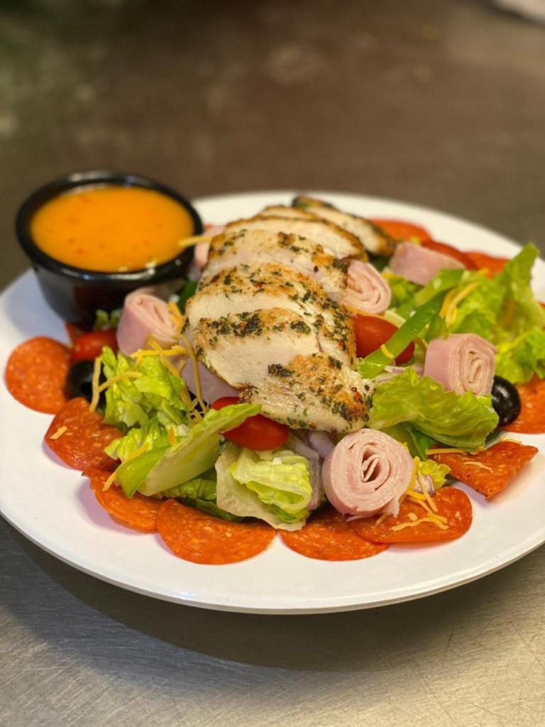 Antipasto Salad · Tossed salad with pepperoni, ham, and turkey. Comes with Italian dressing.