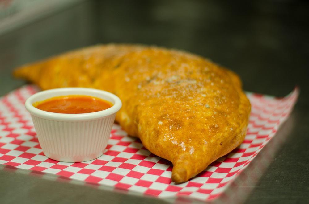 Supreme Calzone · Cheese with pepperoni, sausage, mushrooms, onions and bell peppers.
