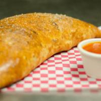 Greek Calzone · Cheese with spinach, feta cheese, artichoke hearts, sun-dried tomatoes and banana peppers.
