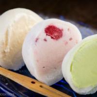 Mochi Ice Cream · 2 pieces. Choice of chocolate, strawberry, mango, or green tea.