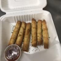 6 Pieces Cigar Borek · Feta cheese with parsley wrapped in homemade dough and deep fried.