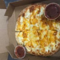 Cheesy Bread · Homemade dough topped with cheddar and mozzarella cheese, served with marinara sauce.