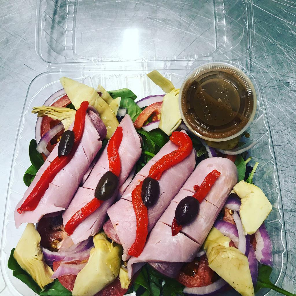 Antipasto Salad · Mixed greens, tomatoes, red onions, artichokes, roasted red peppers, ham, Genoa salami, prosciutto slices and balsamic vinaigrette. Served with slice of garlic bread.  