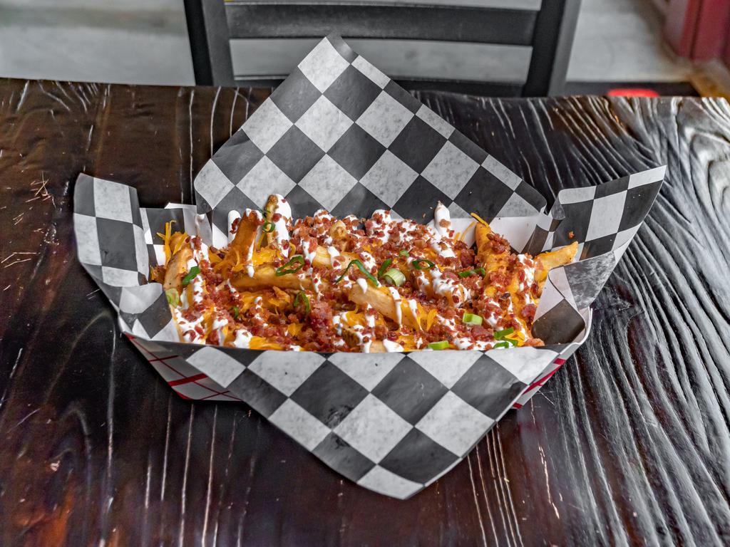 Loaded Fries · Loaded with cheddar, bacon, sour cream and scallions.