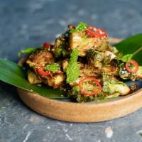 Crispy Brussel Sprouts · Yuzu, Olive Oil, Mint, Pickled Fresno Chilies, salt and pepper.