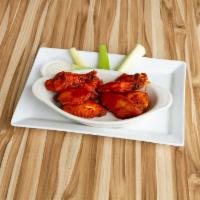Cholula Wings · Jumbo wings tossed in a BBQ, spicy cholula, and chile de arbol sauce. Served with celery and...