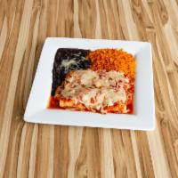 Chicken Enchilada Platter · Two corn tortillas rolled with seasoned shredded chicken topped with ranchera salsa and melt...
