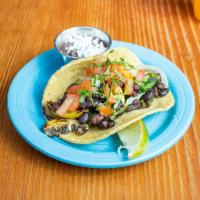 Tacos · Served on fresh corn tortillas, your choice of meat, fish or vegetarian.
