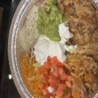 Carnitas Platter · Braised and shredded pork accompanied by Spanish rice, beans, salsa fresca, guacamole, sour ...