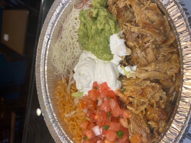 Carnitas Platter · Braised and shredded pork accompanied by Spanish rice, beans, salsa fresca, guacamole, sour cream and your choice of tortillas.