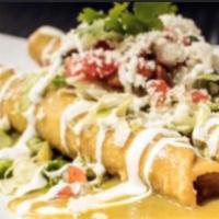 Chicken Flauta Platter · Topped with tomatillo sauce, queso fresco, sour cream and salsa fresca, served with rice and...