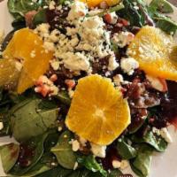 Baby Spinach Salad · Toasted pecans, Mandarin orange wedges, roasted bacon and queso panela tossed with raspberry...