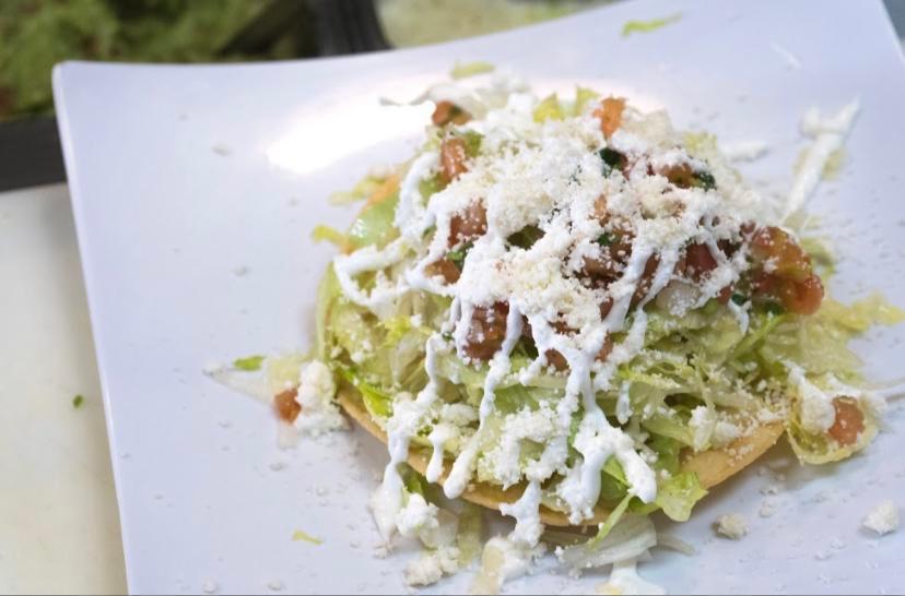 Tostada Salad · Double decker tostada salad with beans, lettuce, salsa fresca, guacamole, sour cream, queso fresco, and your choice of meat.