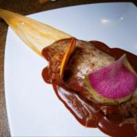 2 Homemade Tamales · Your choice of pork, chicken or sweet potato, topped with red (sweet) enchilada sauce and Ja...